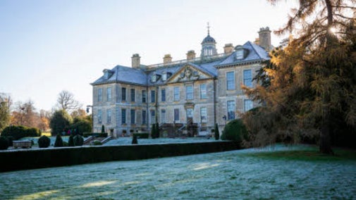 View of the house through the wintry parkland at Belton Estate, Lincolnshire